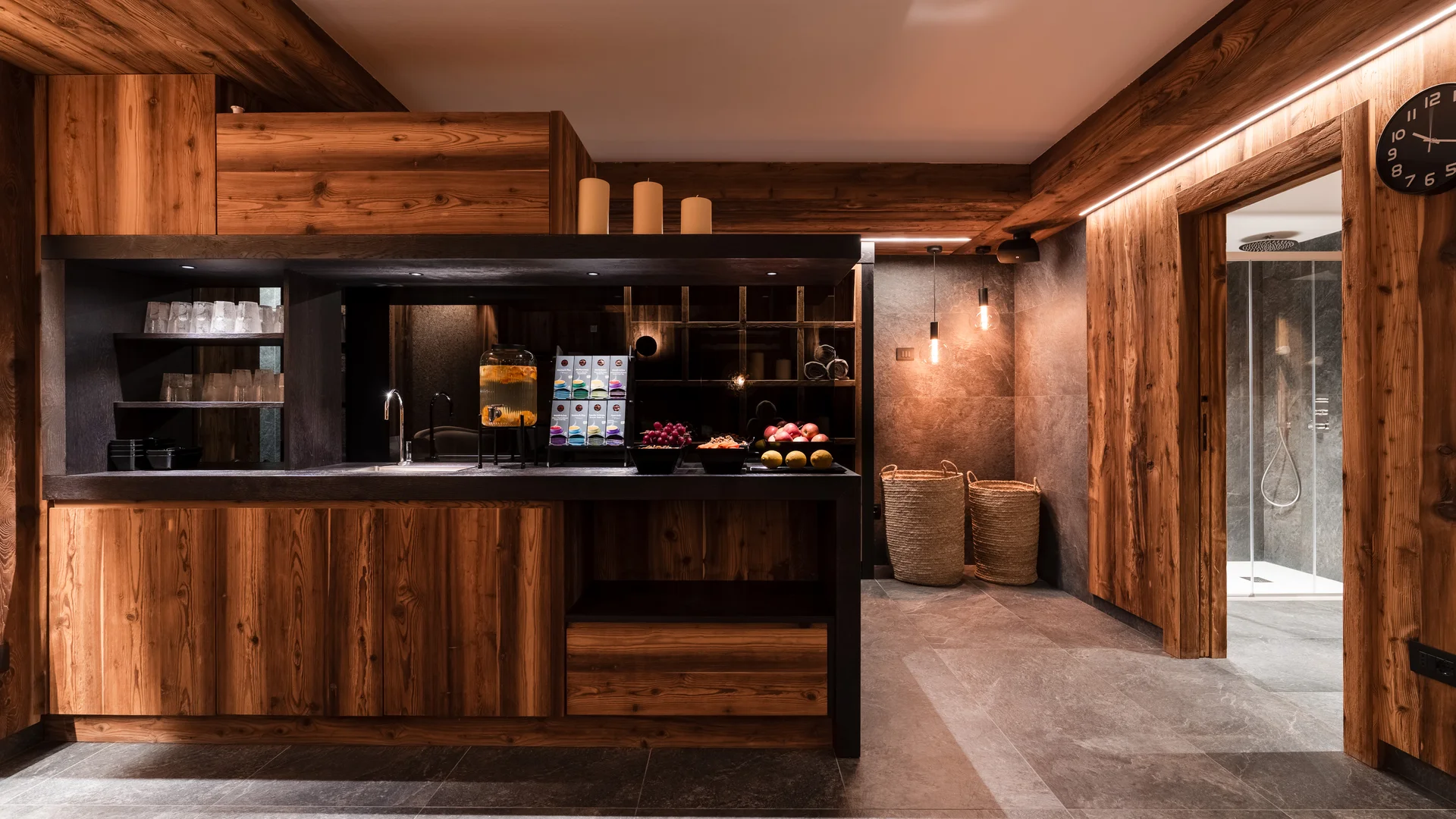 Wooden kitchenette with drinks and fruit in modern room
